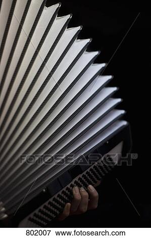 A human hand playing an accordion View Large Photo Image Stock Photo - A human hand playing an accordion. Fotosearch