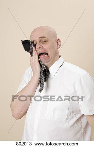A man crying into his tie View Large Photo Image Stock Image - A man crying into his tie. Fotosearch