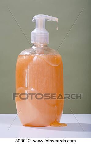 Stock Image - A dripping soap dispenser. Fotosearch