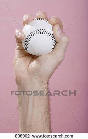A human hand holding a baseball View Large Photo Image Stock Image - A human hand holding a baseball. Fotosearch