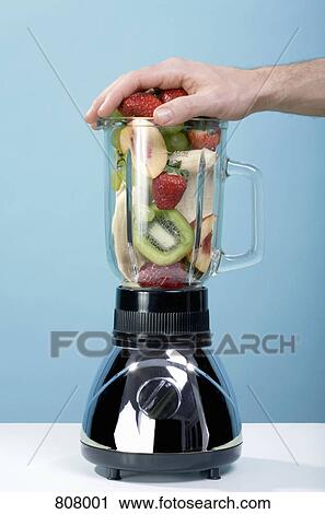 A human hand pressing fruit in a blender View Large Photo Image Stock Image - A human hand pressing fruit in a blender. Fotosearch