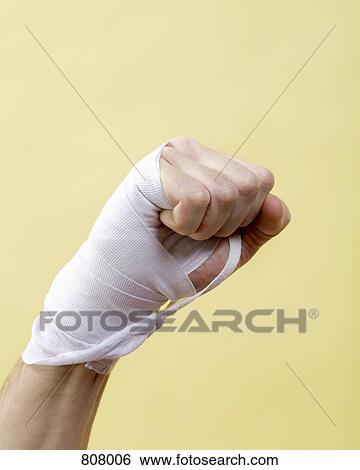 Stock Photograph - A human hand with a bandage on it. Fotosearch