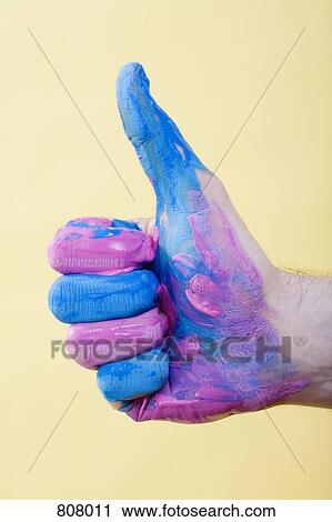 A human hand with paint on it giving a thumbs up View Large Photo Image Stock Image - A human hand with paint on it giving a thumbs up. Fotosearch
