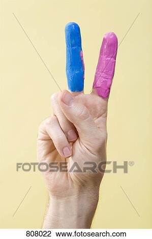 A human hand with paint on it making a peace sign View Large Photo Image Stock Image - A human hand with paint on it making a peace sign. Fotosearch