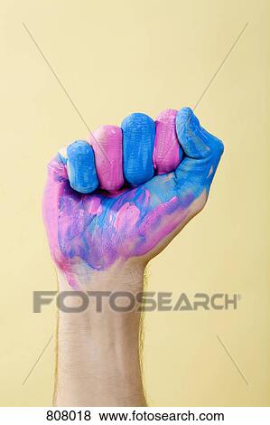 A human hand with paint on it making a fist View Large Photo Image Stock Photo - A human hand with paint on it making a fist. Fotosearch