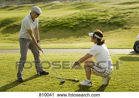 A golf instructor advising a golfer View Large Photo Image Stock Image - A golf instructor advising a golfer. Fotosearch