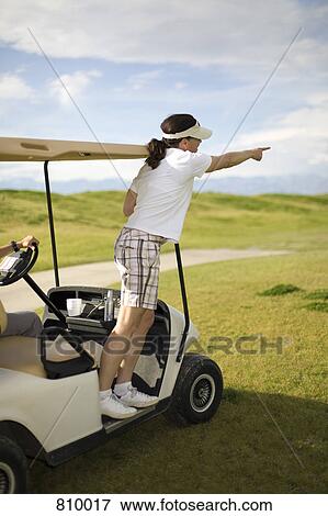 A golfer pointing from a golf cart, Palm Springs, California, USA View Large Photo Image Stock Photo - A golfer pointing from a golf cart, Palm Springs, California, USA. Fotosearch