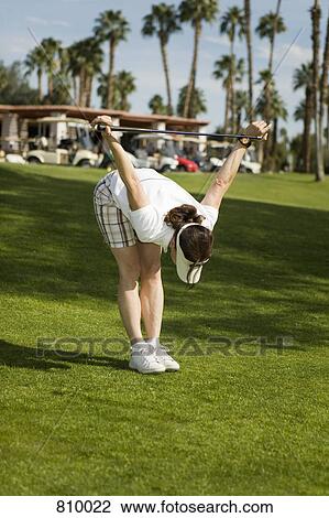 A golfer stretching View Large Photo Image Stock Image - A golfer stretching. Fotosearch