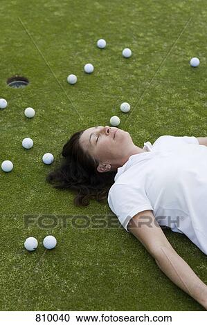An exhausted golfer lying down on a golf course View Large Photo Image Stock Image - An exhausted golfer lying down on a golf course. Fotosearch