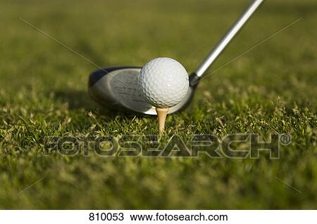Detail of a golf club next to a golf ball on a tee View Large Photo Image Stock Image - Detail of a golf club next to a golf ball on a tee. Fotosearch