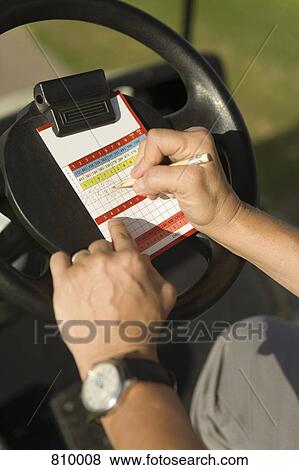 Detail of a golfer keeping score View Large Photo Image Stock Photo - Detail of a golfer keeping score. Fotosearch