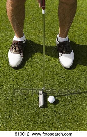 Detail of a golfer putting View Large Photo Image Stock Image - Detail of a golfer putting. Fotosearch