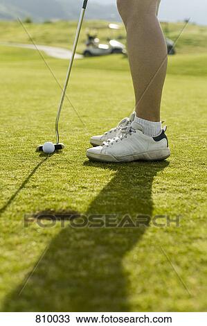 Detail of a golfer putting View Large Photo Image Stock Image - Detail of a golfer putting. Fotosearch