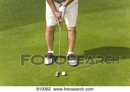 Detail of a golfer putting View Large Photo Image Stock Image - Detail of a golfer putting. Fotosearch
