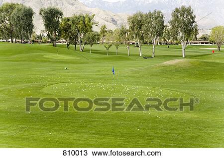 Golf balls on and around a putting green, Palm Springs, California, USA View Large Photo Image Stock Image - Golf balls on and around a putting green, Palm Springs, California, USA. Fotosearch