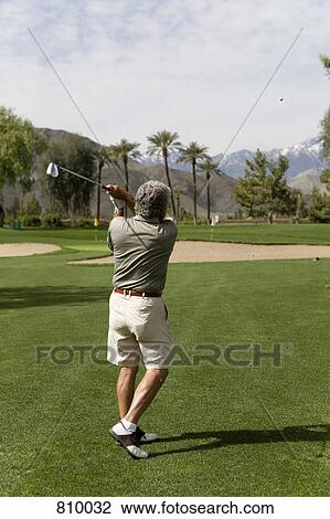 Rear view of a man playing golf, Palm Springs, California, USA View Large Photo Image Stock Image - Rear view of a man playing golf, Palm Springs, California, USA. Fotosearch