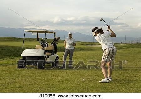 Two women playing golf together, Palm Springs, California, USA View Large Photo Image Stock Photo - Two women playing golf together, Palm Springs, California, USA. Fotosearch