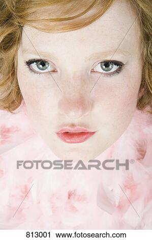 A portrait of a young woman wearing a pink feather boa View Large Photo Image Stock Image - A portrait of a young woman wearing a pink feather boa. Fotosearch