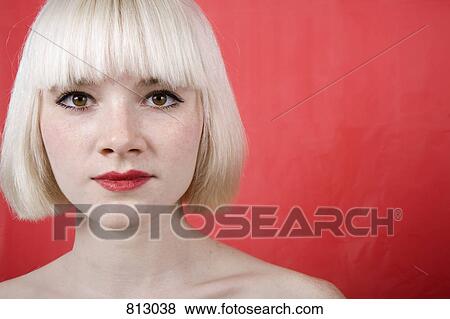 Stock Photo - A portrait of a young woman with a blonde bob. Fotosearch