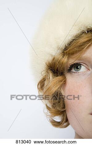 A woman with curly red hair wearing a fur hat View Large Photo Image Stock Image - A woman with curly red hair wearing a fur hat. Fotosearch