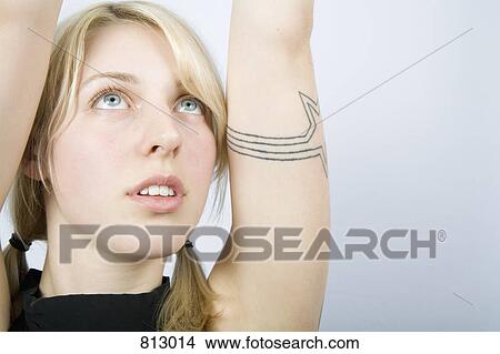 A young woman stretching her arms View Large Photo Image Picture - A young woman stretching her arms. Fotosearch