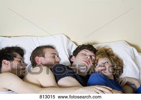 Four friends lying in a bed together View Large Photo Image Stock Photography - Four friends lying in a bed together. Fotosearch