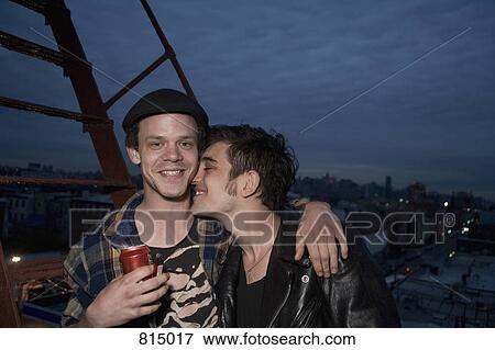 A young couple embracing on a fire escape View Large Photo Image Stock Photo - A young couple embracing on a fire escape. Fotosearch