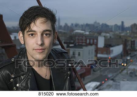 Portrait of a young man on a fire escape View Large Photo Image Stock Image - Portrait of a young man on a fire escape. Fotosearch