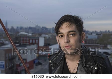 Portrait of a young man on a fire escape View Large Photo Image Stock Image - Portrait of a young man on a fire escape. Fotosearch
