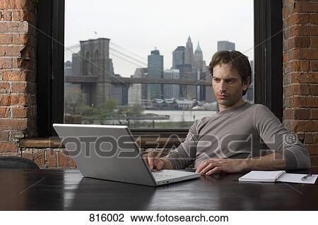 A man using laptop View Large Photo Image Stock Image - A man using laptop. Fotosearch