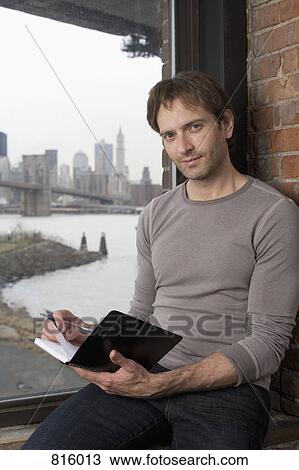 Man sitting on a window sill View Large Photo Image Stock Image - Man sitting on a window sill. Fotosearch