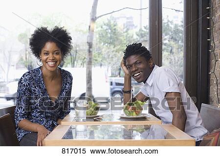 A young couple at a restaurant together View Large Photo Image Stock Photography - A young couple at a restaurant together. Fotosearch