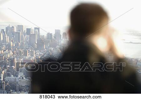 A man taking a photograph of the cityscape, Manhattan, New York City View Large Photo Image Stock Image - A man taking a photograph of the cityscape, Manhattan, New York City. Fotosearch
