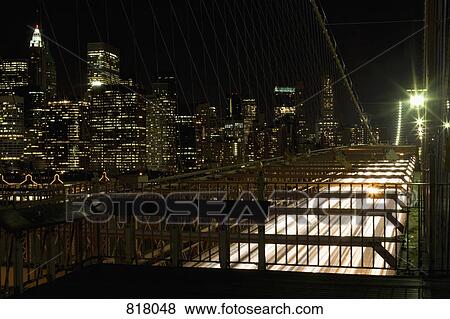Brooklyn Bridge and Manhattan skyline at night, New York City View Large Photo Image Stock Photo - Brooklyn Bridge and Manhattan skyline at night, New York City. Fotosearch
