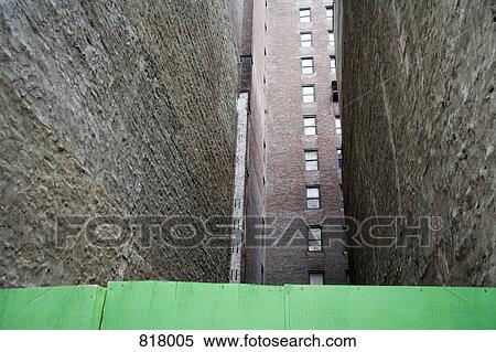Stock Photography - Low Angle View between buildings, New York City, USA. Fotosearch
