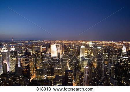 Stock Image - Manhattan skyline at night, New York City. Fotosearch