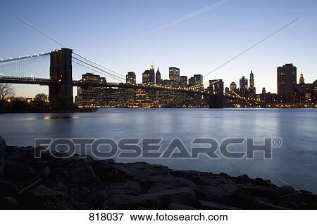 Stock Photo - The Brooklyn Bridge and Manhattan at sunset, New York City. Fotosearch
