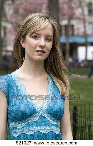 Portrait of a young woman in a city park, Central Park, New York City View Large Photo Image Stock Photo - Portrait of a young woman in a city park, Central Park, New York City. Fotosearch