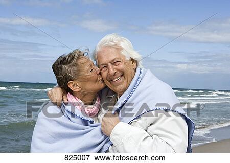 A senior couple walking on a beach together View Large Photo Image Stock Photo - A senior couple walking on a beach together. Fotosearch