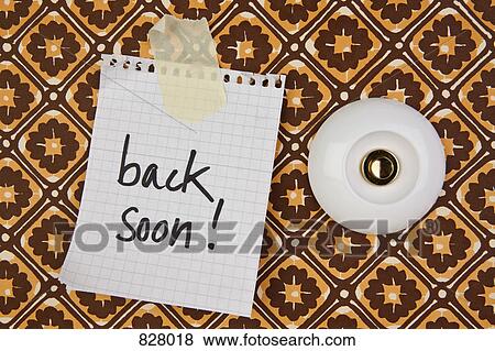 A doorbell with a handwritten note taped next to it with the message back soon! View Large Photo Image Stock Photo - A doorbell with a handwritten note taped next to it with the message back soon!. Fotosearch