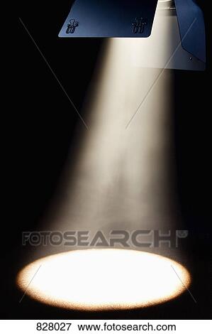 A spotlight shining on an empty floor View Large Photo Image Stock Photo - A spotlight shining on an empty floor. Fotosearch