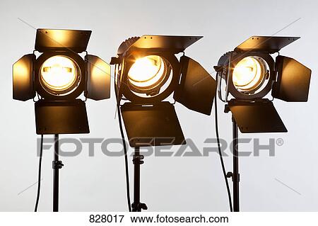Three illuminated spotlights View Large Photo Image Stock Photo - Three illuminated spotlights. Fotosearch