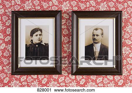 Two photographs hanging on a wallpapered wall View Large Photo Image Stock Image - Two photographs hanging on a wallpapered wall. Fotosearch