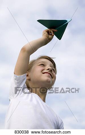 A young girl holding a model airplane View Large Photo Image Stock Photo - A young girl holding a model airplane. Fotosearch