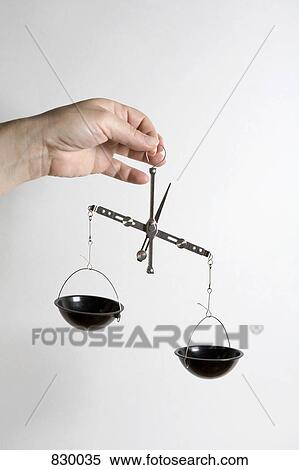 Detail of a person holding weighing scales View Large Photo Image Stock Photography - Detail of a person holding weighing scales. Fotosearch