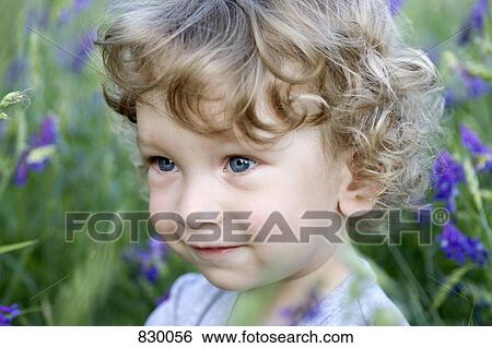 Portrait of a young boy looking away View Large Photo Image Stock Photograph - Portrait of a young boy looking away. Fotosearch