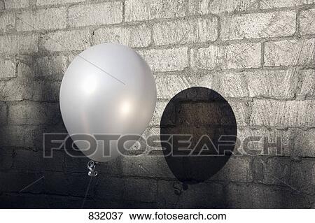 A balloon next to a brick wall View Large Photo Image Stock Photo - A balloon next to a brick wall. Fotosearch