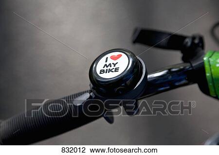 Stock Image - A bike bell on a bike handle. Fotosearch