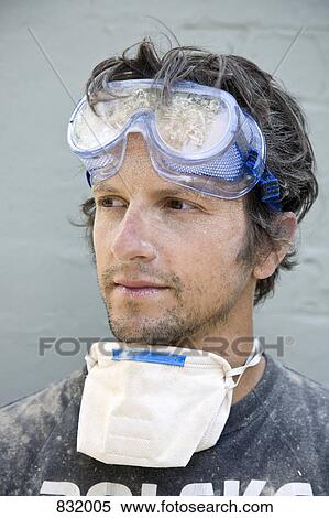 Stock Photography - A man covered in dust, portrait. Fotosearch