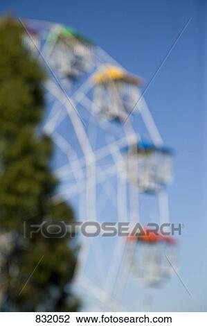 Blurred view of a ferris wheel View Large Photo Image Stock Image - Blurred view of a ferris wheel. Fotosearch
